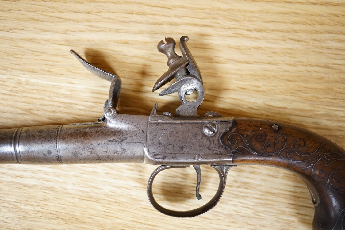 A Queen Anne style box lock flintlock travelling pistol, with turn off cannon barrel, 6cm, frame engraved; T. Lane, sliding trigger guard safety, rounded walnut grip with silver wire inlay and grotesque silver butt cap (